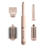 Hair styling tool with interchangeable attachments on a white background